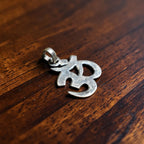 Handcrafted silver om symbol pendant online India MYRA