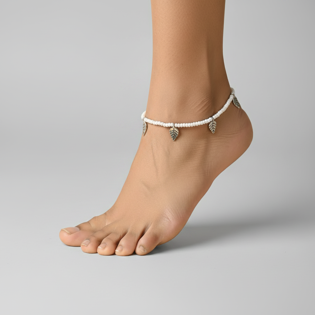 Handcrafted White Glass Beaded Anklet with Leaf Charms