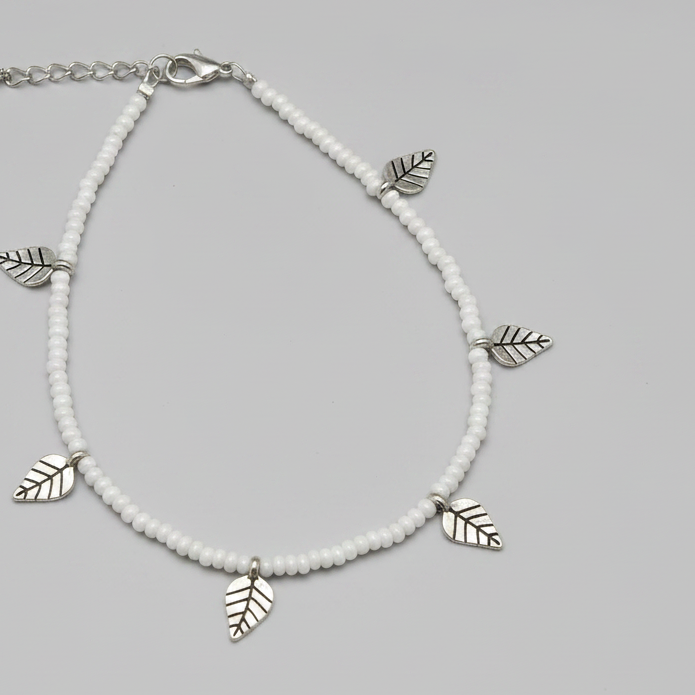 Handcrafted White Glass Beaded Anklet with Leaf Charms