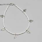 Handcrafted White Glass Beaded Anklet with Leaf Charms