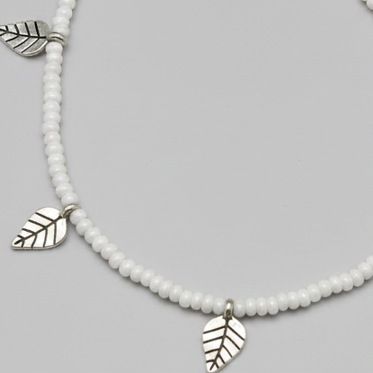 Handcrafted White Glass Beaded Anklet with Leaf Charms