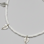 Handcrafted White Glass Beaded Anklet with Leaf Charms